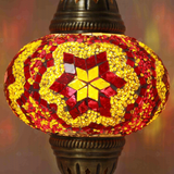 Lit close-up of mosaic glass globe — Amber table lamp glowing (ENV MUN3025)