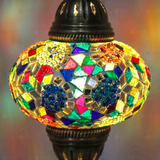 Lit close-up of mosaic glass globe — Multicolor table lamp glowing (ENV MUN3029)