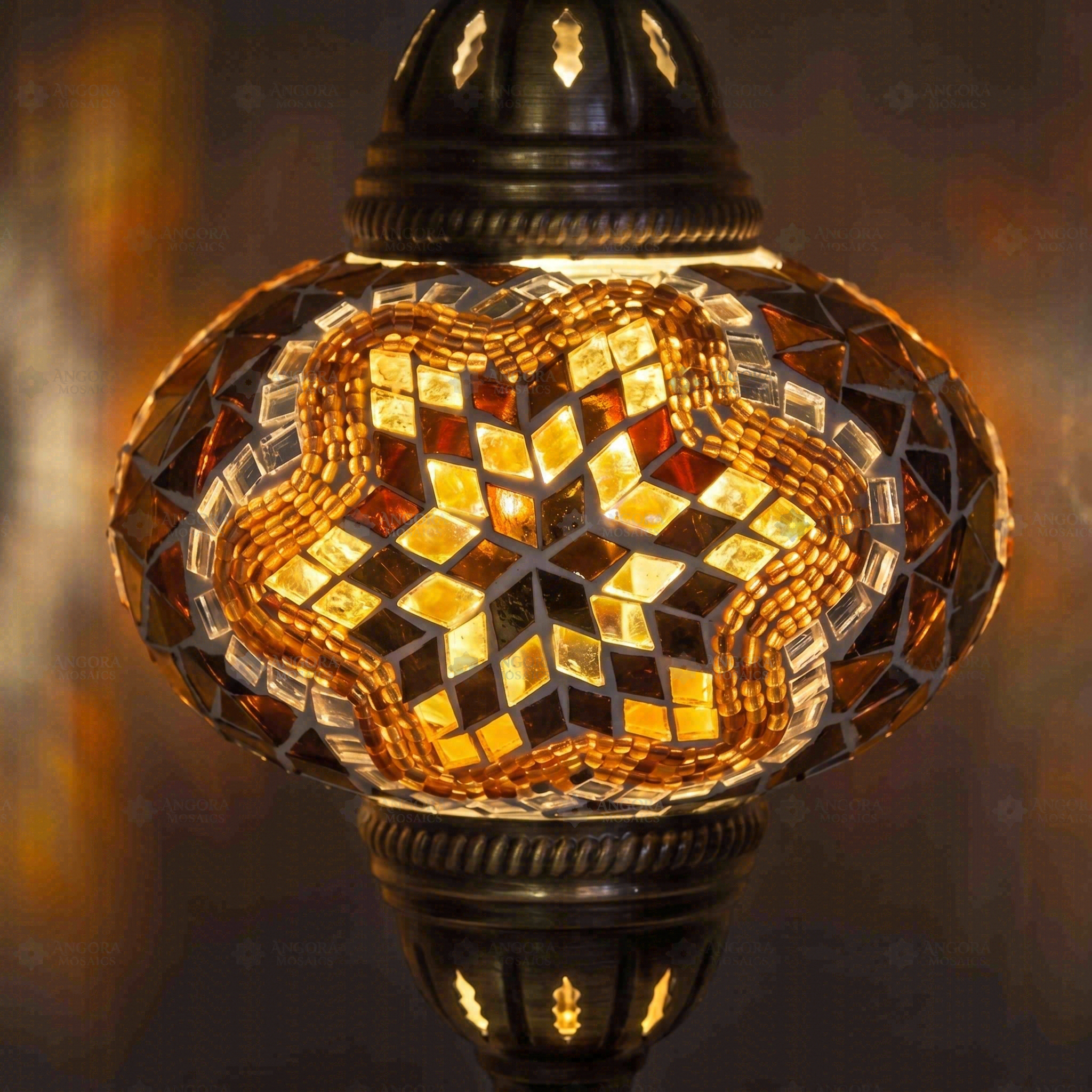 Lit close-up of mosaic glass globe — Amber table lamp glowing (ENV MUN3031)