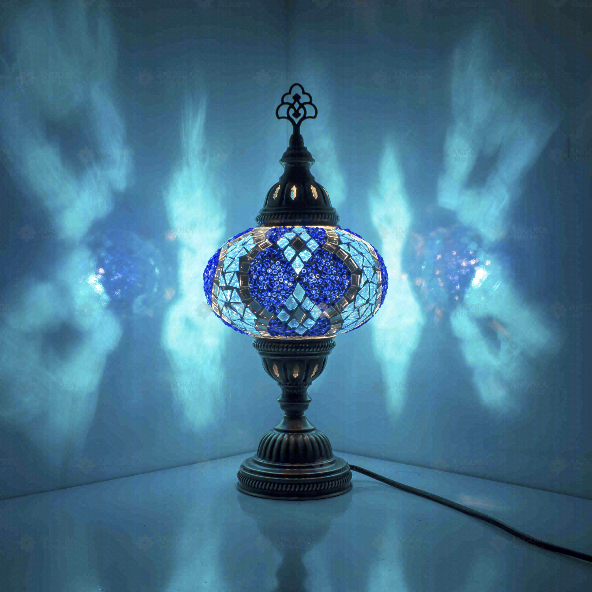 Blue Turkish mosaic table lamp illuminated, showing colorful light projection (ENV MUN3053)