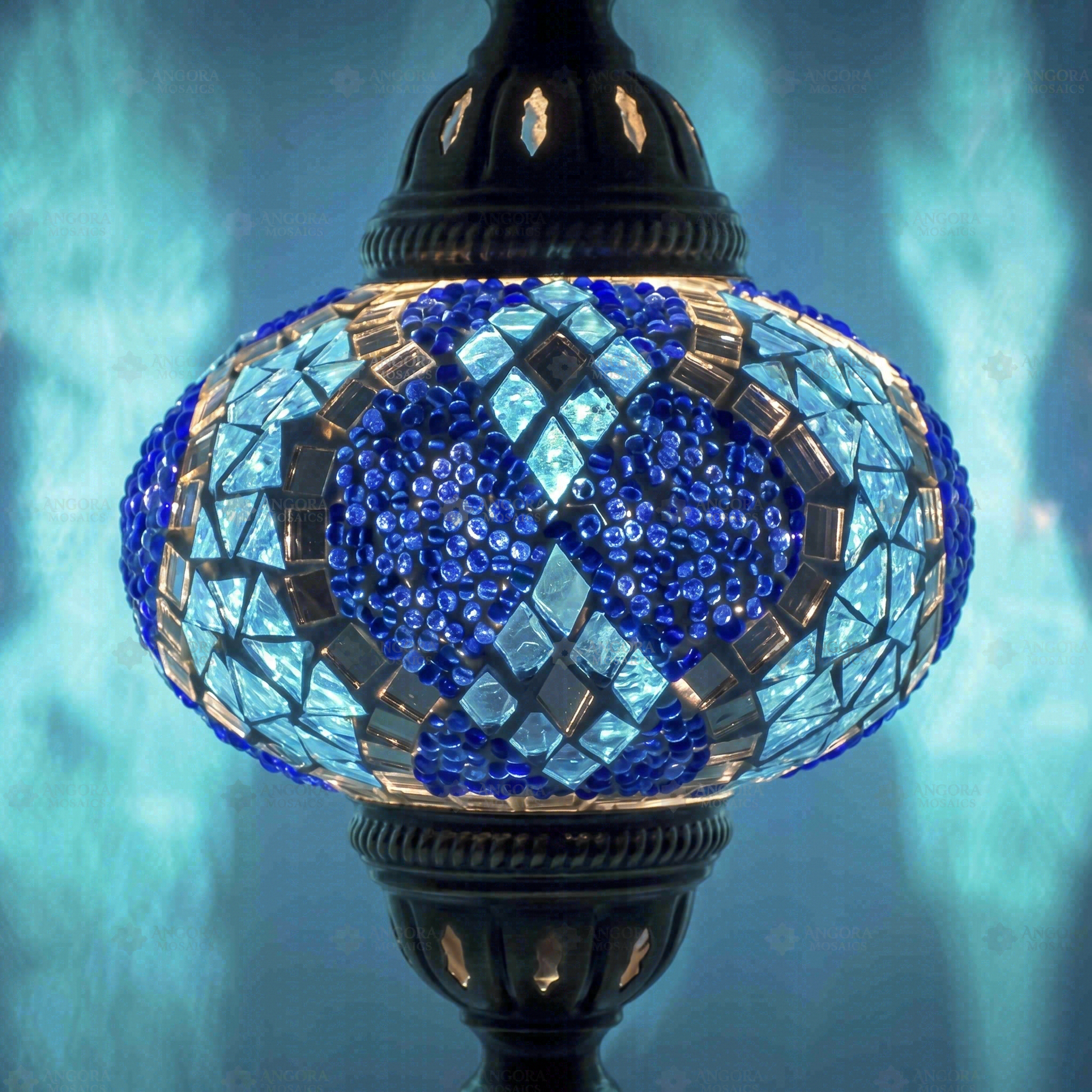 Lit close-up of mosaic glass globe — Blue table lamp glowing (ENV MUN3053)