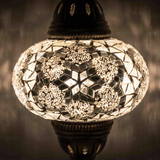 Lit close-up of mosaic glass globe — White table lamp glowing (ENV MUN3054)