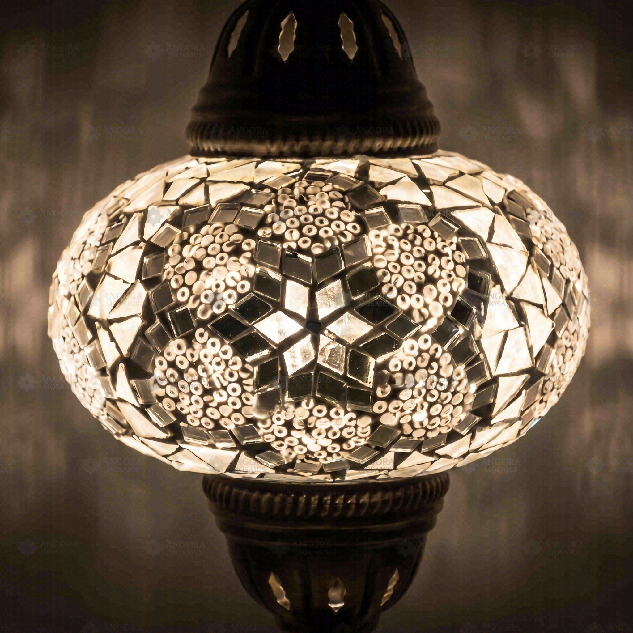 Lit close-up of mosaic glass globe — White table lamp glowing (ENV MUN3054)