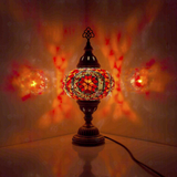 Amber Turkish mosaic table lamp illuminated, showing colorful light projection (ENV MUN3056)