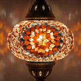 Lit close-up of mosaic glass globe — Amber table lamp glowing (ENV MUN3065)