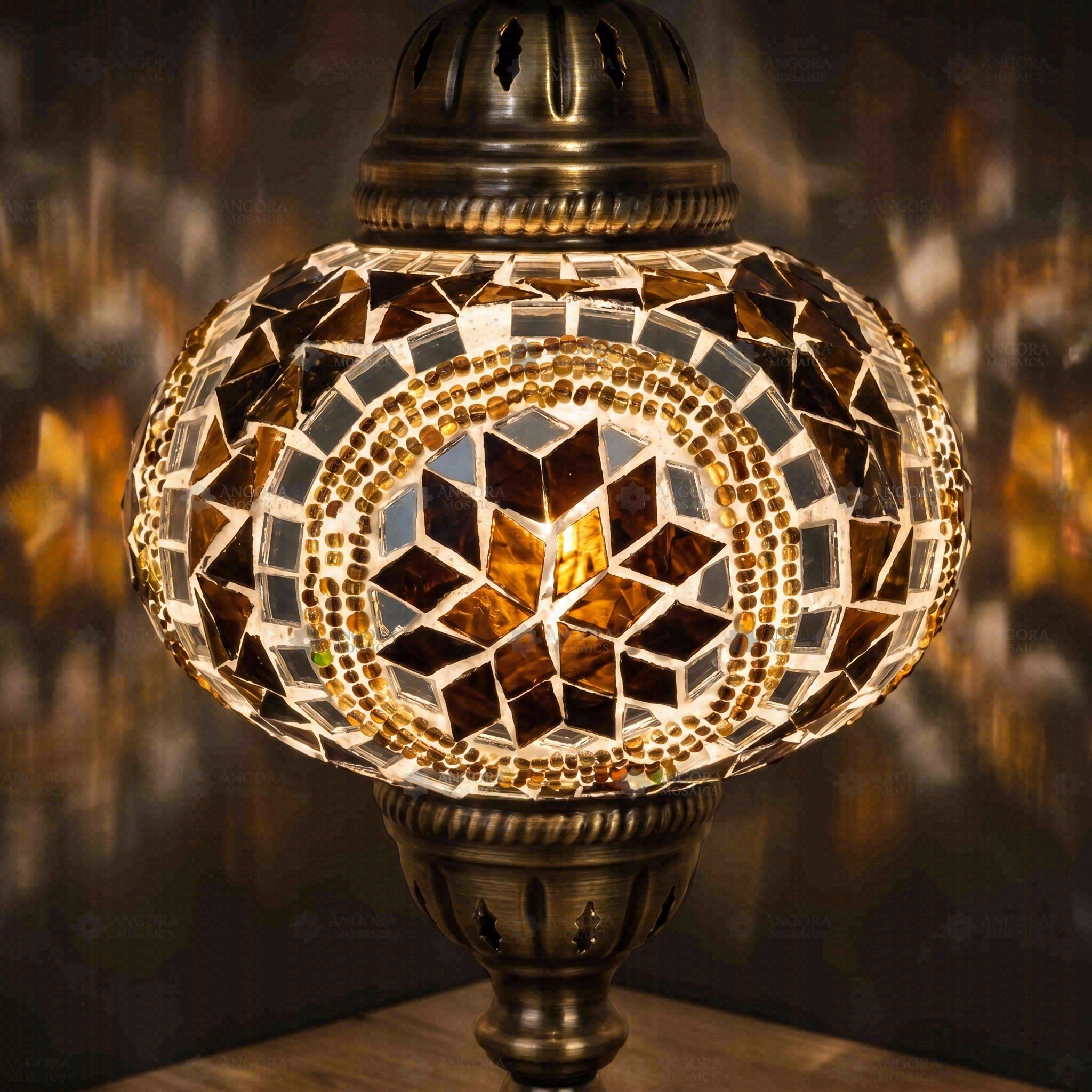 Lit close-up of mosaic glass globe — Amber table lamp glowing (ENV MUN3067)