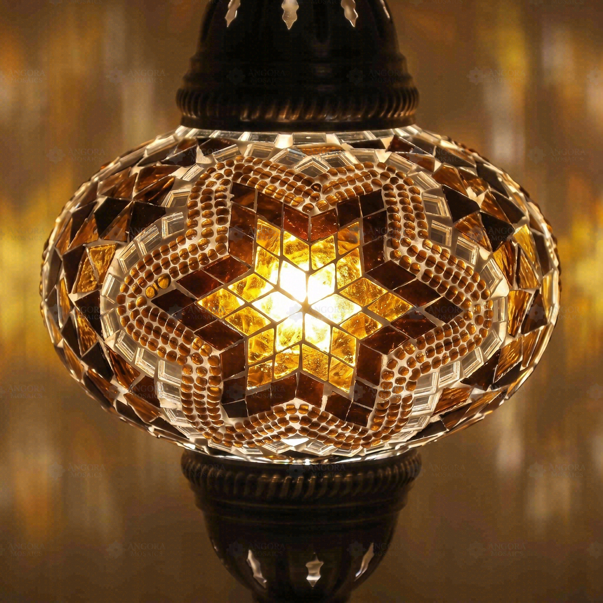 Lit close-up of mosaic glass globe — Amber table lamp glowing (ENV MUN3088)