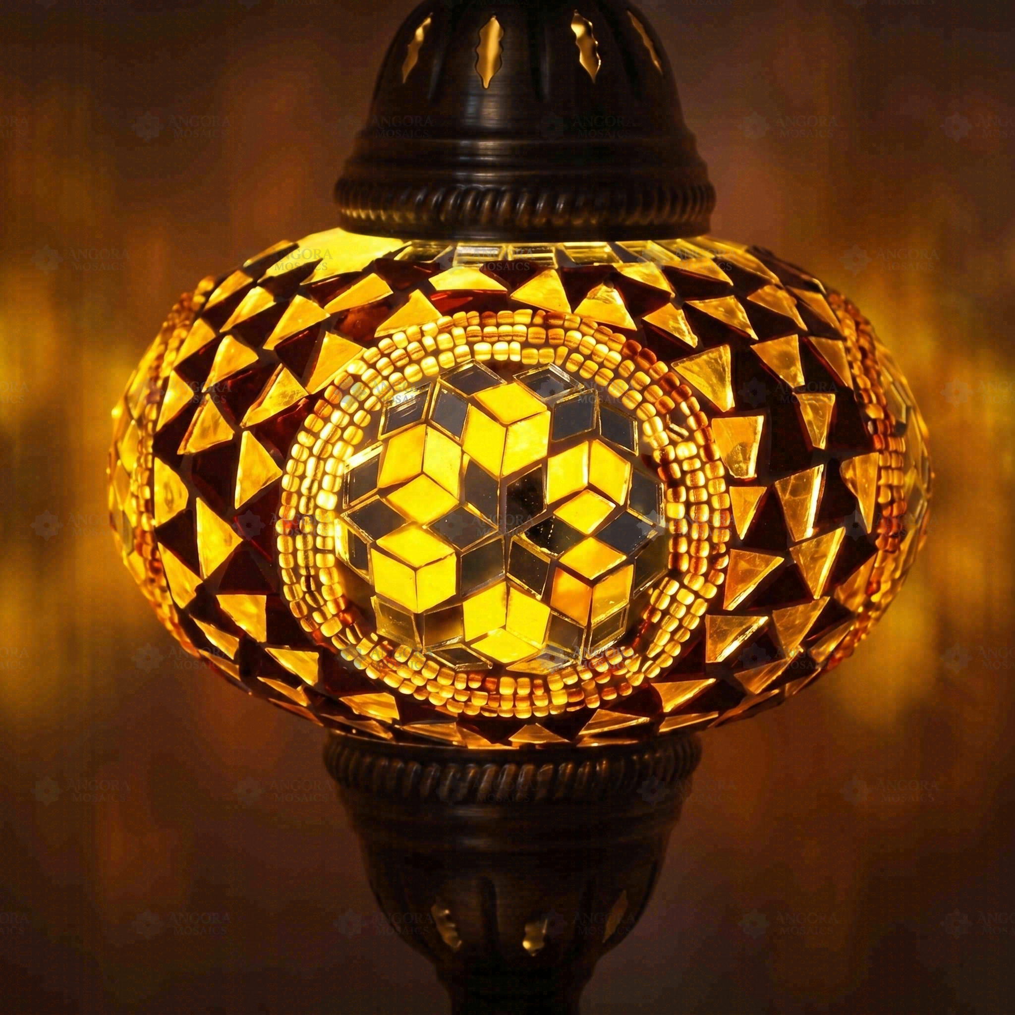 Lit close-up of mosaic glass globe — Amber table lamp glowing (ENV MUN3089)