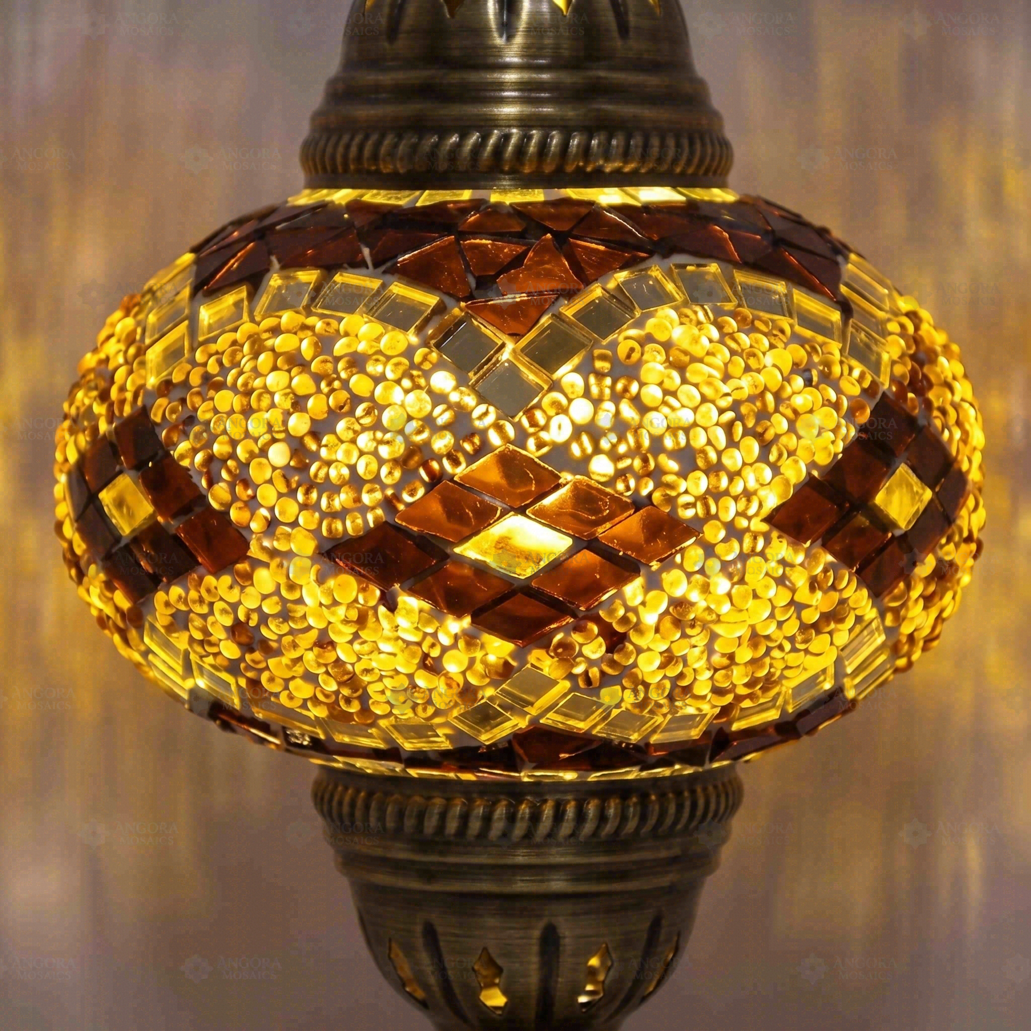 Lit close-up of mosaic glass globe — Amber table lamp glowing (ENV MUN3092)