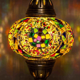 Lit close-up of mosaic glass globe — Multicolor table lamp glowing (ENV MUN3099)