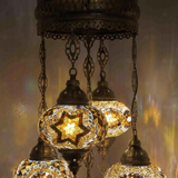 Lit close-up of mosaic glass globe — Warm Tones chandelier glowing (ENV SLT5N3 (13-26-31-64-67))