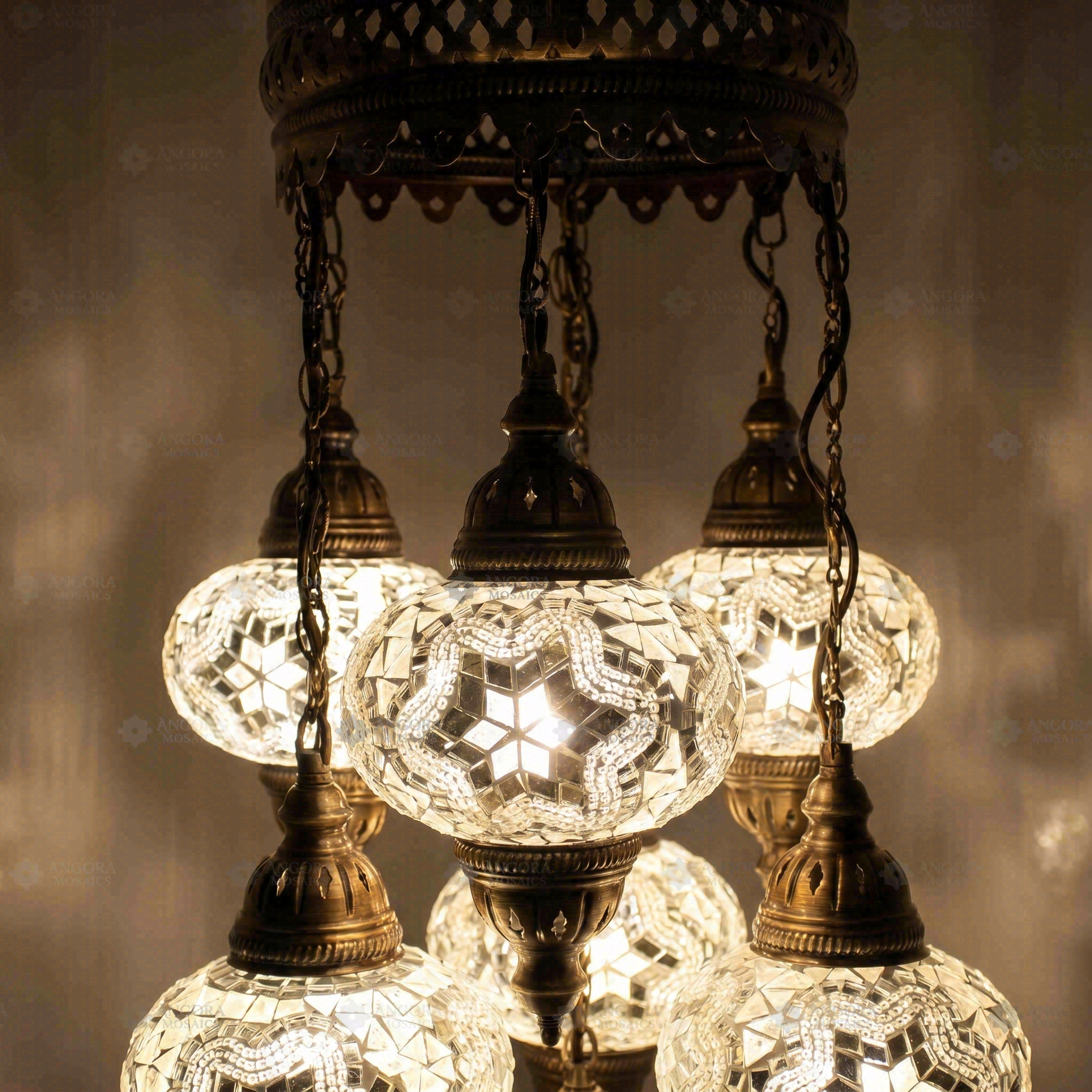 Lit close-up of mosaic glass globe — White chandelier glowing (ENV SLT7N3 (3015))