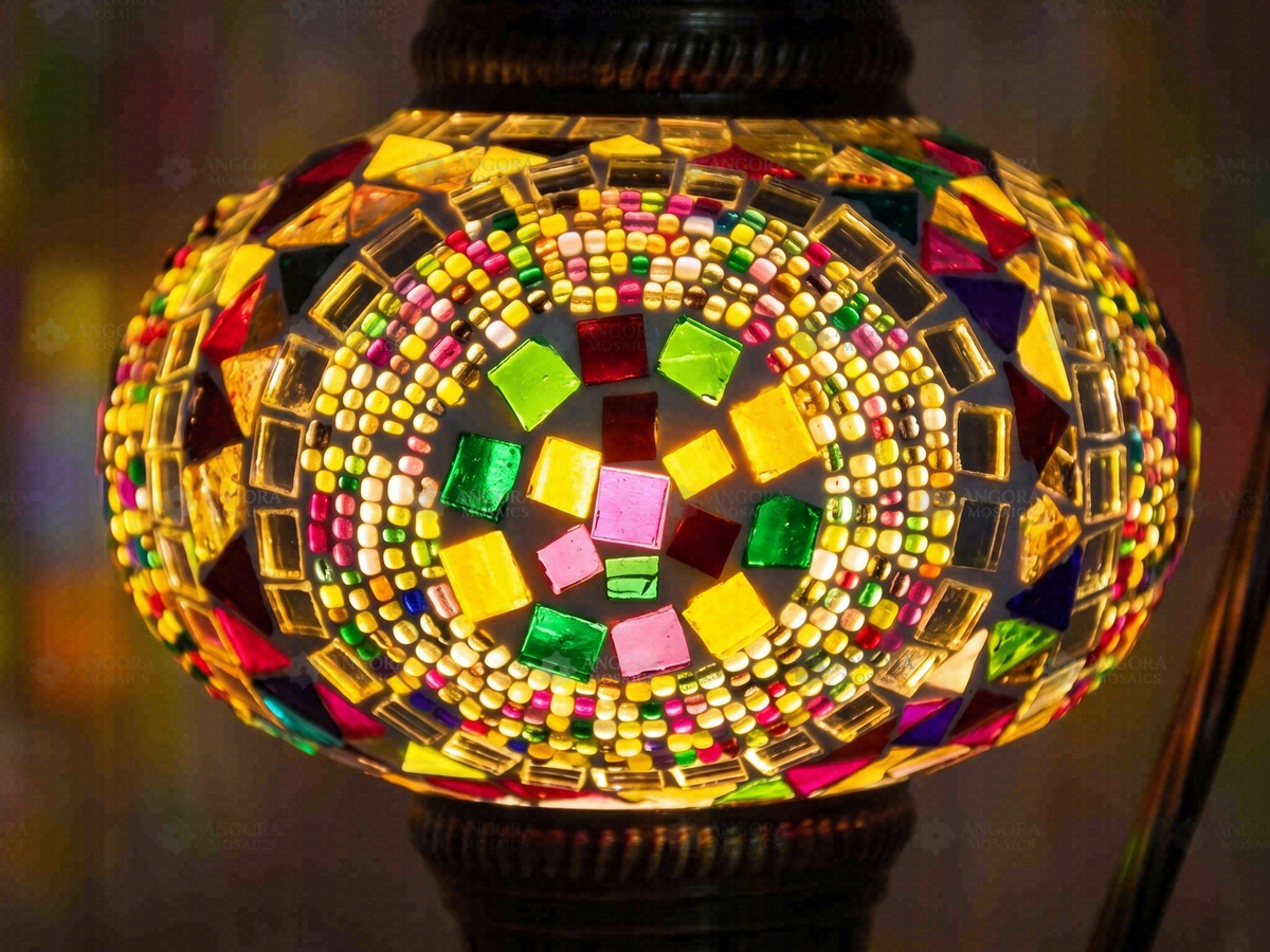 Illuminated multicoloured glass mosaic globe in close-up