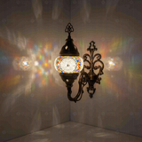 Multicolor Turkish mosaic wall sconce illuminated, showing colorful light projection (ENV APN1013)