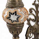 Close-up of Amber warm amber mosaic glass globe pattern — wall sconce (ENV APN1022)