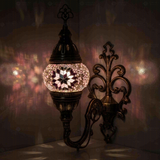 Pink Turkish mosaic wall sconce illuminated, showing colorful light projection (ENV APN1034)