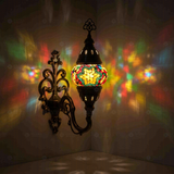 Multicolor Turkish mosaic wall sconce illuminated, showing colorful light projection (ENV APN1042)