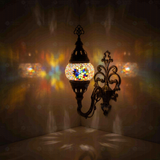 Multicolor Turkish mosaic wall sconce illuminated, showing colorful light projection (ENV APN1061)