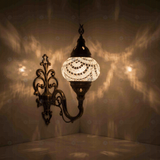 White Turkish mosaic wall sconce illuminated, showing colorful light projection (ENV APN2001)