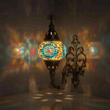 Multicolor Turkish mosaic wall sconce illuminated, showing colorful light projection (ENV APN2010)