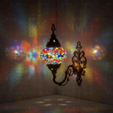 Multicolor Turkish mosaic wall sconce illuminated, showing colorful light projection (ENV APN2012)
