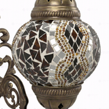 Close-up of Amber warm amber mosaic glass globe pattern — wall sconce (ENV APN2015)