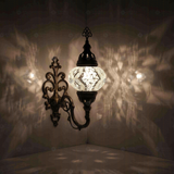 White Turkish mosaic wall sconce illuminated, showing colorful light projection (ENV APN2017)