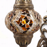 Close-up of Amber warm amber mosaic glass globe pattern — wall sconce (ENV APN2025)