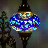 Lit close-up of mosaic glass globe — Blue wall sconce glowing (ENV APN3005)