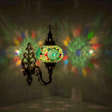 Blue Turkish mosaic wall sconce illuminated, showing colorful light projection (ENV APN3006)