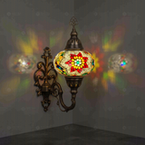 Multicolor Turkish mosaic wall sconce illuminated, showing colorful light projection (ENV APN3007)