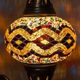 Lit close-up of mosaic glass globe — Multicolor wall sconce glowing (ENV APN3013)