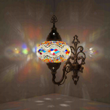 Multicolor Turkish mosaic wall sconce illuminated, showing colorful light projection (ENV APN3014)