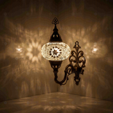 White Turkish mosaic wall sconce illuminated, showing colorful light projection (ENV APN3022)