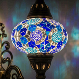 Lit close-up of mosaic glass globe — Blue wall sconce glowing (ENV APN3032)