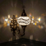 White Turkish mosaic wall sconce illuminated, showing colorful light projection (ENV APN3036)