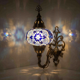 Blue Turkish mosaic wall sconce illuminated, showing colorful light projection (ENV APN3039)