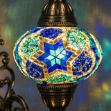 Lit close-up of mosaic glass globe — Blue wall sconce glowing (ENV APN3040)