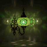 Green Turkish mosaic wall sconce illuminated, showing colorful light projection (ENV APN3048)