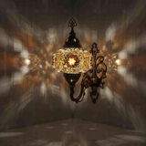Amber Turkish mosaic wall sconce illuminated, showing colorful light projection (ENV APN3049)