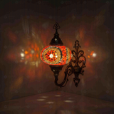 Red Turkish mosaic wall sconce illuminated, showing colorful light projection (ENV APN3052)