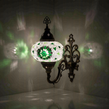 Green Turkish mosaic wall sconce illuminated, showing colorful light projection (ENV APN3055)