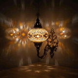Amber Turkish mosaic wall sconce illuminated, showing colorful light projection (ENV APN3057)