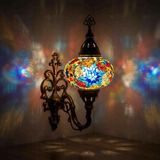 Multicolor Turkish mosaic wall sconce illuminated, showing colorful light projection (ENV APN3061)