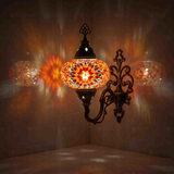 Amber Turkish mosaic wall sconce illuminated, showing colorful light projection (ENV APN3065)