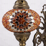 Close-up of Amber warm amber mosaic glass globe pattern — wall sconce (ENV APN3065)