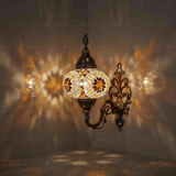 Amber Turkish mosaic wall sconce illuminated, showing colorful light projection (ENV APN3067)