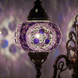 Lit close-up of mosaic glass globe — Purple wall sconce glowing (ENV APN3087)