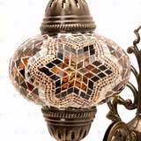 Close-up of Amber warm amber mosaic glass globe pattern — wall sconce (ENV APN3088)