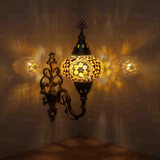 Amber Turkish mosaic wall sconce illuminated, showing colorful light projection (ENV APN3089)